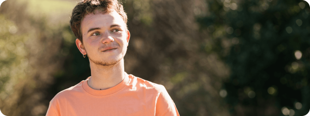 An individual wearing a peach shirt
